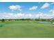 Picturesque golf course view with residential homes in the distance at 11116 Jenkins Ct, San Antonio, FL 33576