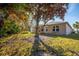 Tan house exterior with large tree in the front yard at 11116 Jenkins Ct, San Antonio, FL 33576