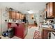 Kitchen with breakfast bar and view into dining room at 11116 Jenkins Ct, San Antonio, FL 33576