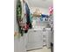 Laundry room with washer, dryer, and shelving at 11116 Jenkins Ct, San Antonio, FL 33576