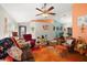 Spacious living room with hardwood floors and a ceiling fan at 11116 Jenkins Ct, San Antonio, FL 33576