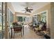 Relaxing screened porch with seating and table at 11116 Jenkins Ct, San Antonio, FL 33576