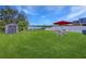 Backyard with patio furniture, shed and lake view at 11338 Southwind Lake Dr, Gibsonton, FL 33534