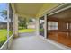 Bright screened porch with access to backyard and interior at 11609 Weaver Park Ct, Trinity, FL 34655