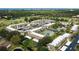 Aerial view of condo community with tennis court and pool at 12300 Vonn Rd # 6103, Largo, FL 33774