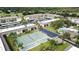 Aerial view of condo community with tennis and shuffleboard courts at 12300 Vonn Rd # 6103, Largo, FL 33774
