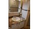 Vanity with granite countertop and large mirror at 12300 Vonn Rd # 6103, Largo, FL 33774