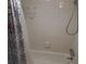 Clean bathroom with shower/tub combo and tiled walls at 12300 Vonn Rd # 6103, Largo, FL 33774