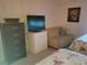 Guest bedroom with twin bed and sitting area at 12300 Vonn Rd # 6103, Largo, FL 33774