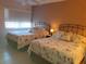 Guest bedroom with two twin beds and window at 12300 Vonn Rd # 6103, Largo, FL 33774