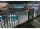 Illuminated community pool at night with surrounding patio at 12300 Vonn Rd # 6103, Largo, FL 33774