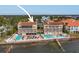 Aerial view of resort showing pool, multiple buildings, and waterfront location at 1420 Bayshore Blvd # 209, Dunedin, FL 34698