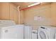 Shared laundry facility with two sets of Whirlpool washer and dryer at 1420 Bayshore Blvd # 209, Dunedin, FL 34698