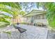 Charming backyard with brick patio, shed, and lush landscaping at 213 W Cayuga St, Tampa, FL 33603
