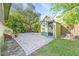 Private backyard with patio, shed, and ample green space at 213 W Cayuga St, Tampa, FL 33603