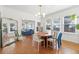 Spacious dining area with hardwood floors and a view of the living room at 213 W Cayuga St, Tampa, FL 33603