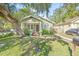Quaint craftsman home with a large front yard and porch at 213 W Cayuga St, Tampa, FL 33603