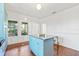 Bright kitchen with an island, stainless steel appliances, and blue cabinets at 213 W Cayuga St, Tampa, FL 33603