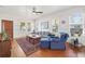 Bright living room with hardwood floors, a comfortable sectional sofa, and large windows at 213 W Cayuga St, Tampa, FL 33603