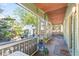 Relaxing screened porch with wood flooring and access to backyard at 213 W Cayuga St, Tampa, FL 33603