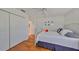 Spacious bedroom with hardwood floors and a large closet at 2337 Platinum Dr, Sun City Center, FL 33573