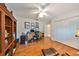 Home office with hardwood floors, built-in shelves, and a desk at 2337 Platinum Dr, Sun City Center, FL 33573