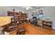 Bright home office with hardwood floors, built-ins and comfortable seating at 2337 Platinum Dr, Sun City Center, FL 33573