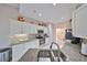 Bright kitchen with granite countertops, stainless steel appliances, and white cabinetry at 2337 Platinum Dr, Sun City Center, FL 33573
