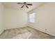 Bright bedroom with ceiling fan and neutral carpeting at 24311 Breezy Oak Ct, Lutz, FL 33559