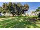 Lush green backyard offers plenty of space for outdoor activities and relaxation at 2460 Persian Dr # 26, Clearwater, FL 33763