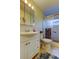 Standard bathroom featuring vanity with mirror and shower with sliding door at 2460 Persian Dr # 26, Clearwater, FL 33763
