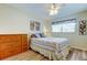 Charming bedroom with ceiling fan and ample natural light and wood laminate flooring at 2460 Persian Dr # 26, Clearwater, FL 33763