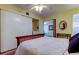 Bedroom featuring wood floors, ceiling fan, and a large closet at 2460 Persian Dr # 26, Clearwater, FL 33763