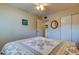 Bright bedroom with wood laminate flooring featuring closet at 2460 Persian Dr # 26, Clearwater, FL 33763