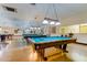 Well-lit billiards room with multiple tables at 2460 Persian Dr # 26, Clearwater, FL 33763