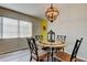 Charming dining area with wood-look floors and a view from a large window at 2460 Persian Dr # 26, Clearwater, FL 33763