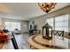 Dining area with wood-look flooring and a view of the living room at 2460 Persian Dr # 26, Clearwater, FL 33763