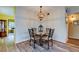 Small dining area with a marble table and four chairs at 2460 Persian Dr # 26, Clearwater, FL 33763