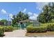 Community dog park with fenced area and shaded seating at 2460 Persian Dr # 26, Clearwater, FL 33763