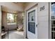 Inviting front porch with seating and a view, leading to the entry door of unit 26 at 2460 Persian Dr # 26, Clearwater, FL 33763