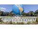 Stunning globe fountain with ornate detailing and lush landscaping at 2460 Persian Dr # 26, Clearwater, FL 33763