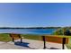 Serene lake view with two park benches at 2460 Persian Dr # 26, Clearwater, FL 33763