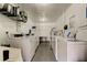 Well-equipped laundry room with several washers and dryers at 2460 Persian Dr # 26, Clearwater, FL 33763