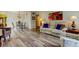 Open living space with wood-look flooring and a view into the dining area at 2460 Persian Dr # 26, Clearwater, FL 33763