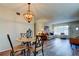 Inviting dining area with wood-look floors and a view into the adjacent living area at 2460 Persian Dr # 26, Clearwater, FL 33763