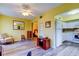 Open-concept living space flows seamlessly from the living area to the kitchen and bedroom at 2460 Persian Dr # 26, Clearwater, FL 33763
