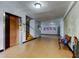 Building lobby with elevator, stairs, and seating at 2460 Persian Dr # 26, Clearwater, FL 33763