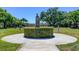 Landscaped garden with statues and walkways at 2460 Persian Dr # 26, Clearwater, FL 33763