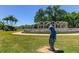 Statues and lush landscaping enhance this community garden at 2460 Persian Dr # 26, Clearwater, FL 33763
