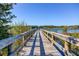 Picturesque wooden pier extending over calm lake waters at 2460 Persian Dr # 26, Clearwater, FL 33763